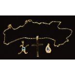 A 9ct gold chain, 9ct gold cross and two yellow metal eye pendants, 5.9g