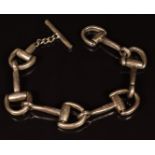 A silver bracelet made up of links in the form of horse stirrups, marked 800