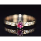 A 9ct gold ring set with a ruby and diamonds, 1.5g, size J