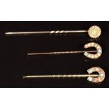 Two 9ct gold stick pins set with turquoise and seed pearls and a 9ct gold stick pin set with