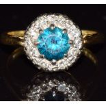 An 18ct gold ring set with a zircon surrounded by diamonds, 4.0g, size J