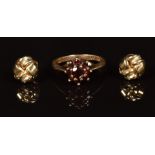 A 9ct gold ring set with a cluster of garnets and a pair of 9ct gold knot earrings, 2.8g