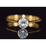 An 18ct gold ring set with a round cut diamond of approximately 0.54ct, 3.0g, size O
