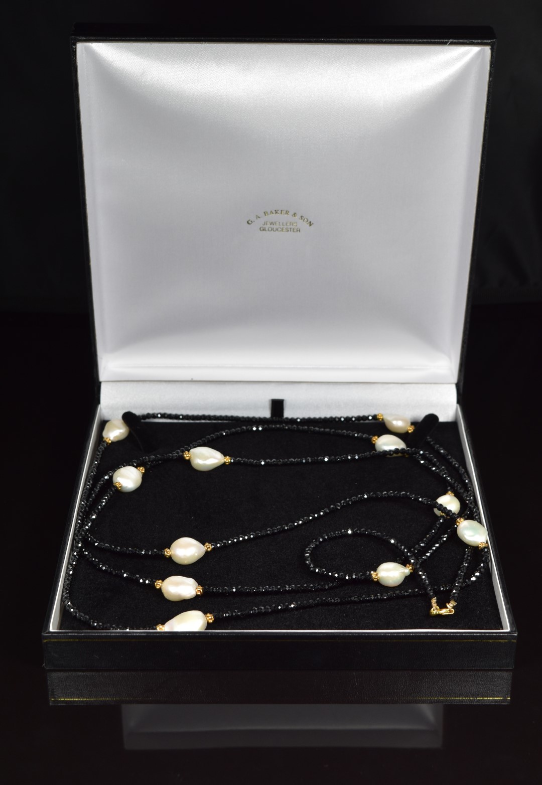 A black garnet, pearl and silver gilt beaded necklace