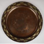 Hugh Wallis (1871- 1943) Arts & Crafts hammered copper charger, with pewter inlaid geometric rim and