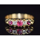 A c1910 18ct gold ring set with rubies and diamonds, 3.8g, size T