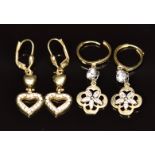 Two pairs of 14k gold earrings set with cubic zirconia, 7g