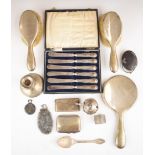 Hallmarked silver items to include candlestick, hand mirror, brushes, card case, silver handled