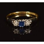 An 18ct gold ring set with a square sapphire and diamonds, 1.9g,