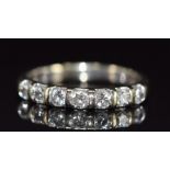 An 18k white gold half eternity ring set with seven diamonds, each approximately 0.07ct, 2.5g,