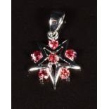 An 18k white gold pendant set with padparadscha sapphires, 2g