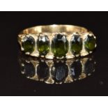 A 9ct gold ring set with five oval cut tourmaline, 4.7g, size S