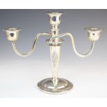 Thai silver three branch candelabra with embossed decoration of a deity to front and back, marked to