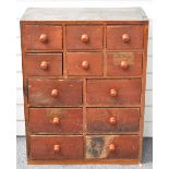 Victorian stained pine haberdashery chest of 12 drawers containing pocket watches, tools, watch