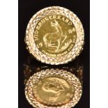 A 9ct gold ring set with a 1984 gold 1/10 Krugerrand, 6.8g, size O/P