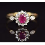 A 9ct gold ring set with a ruby and diamonds, 1.6g, size L