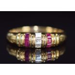 An 18k gold ring set with diamonds and calibre cut rubies, 2.9g, size N