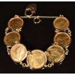 A 9ct gold bracelet set with seven gold full sovereigns comprising 1902, 1903, 1896, 1900, 1909,