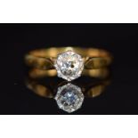 An 18ct gold ring set with a diamond of approximately 0.25ct in a platinum illusion setting, 3.0g,