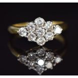 An 18ct gold ring set with nine diamonds, each approximately 0.1ct, in a cluster, 4.9g, size Q