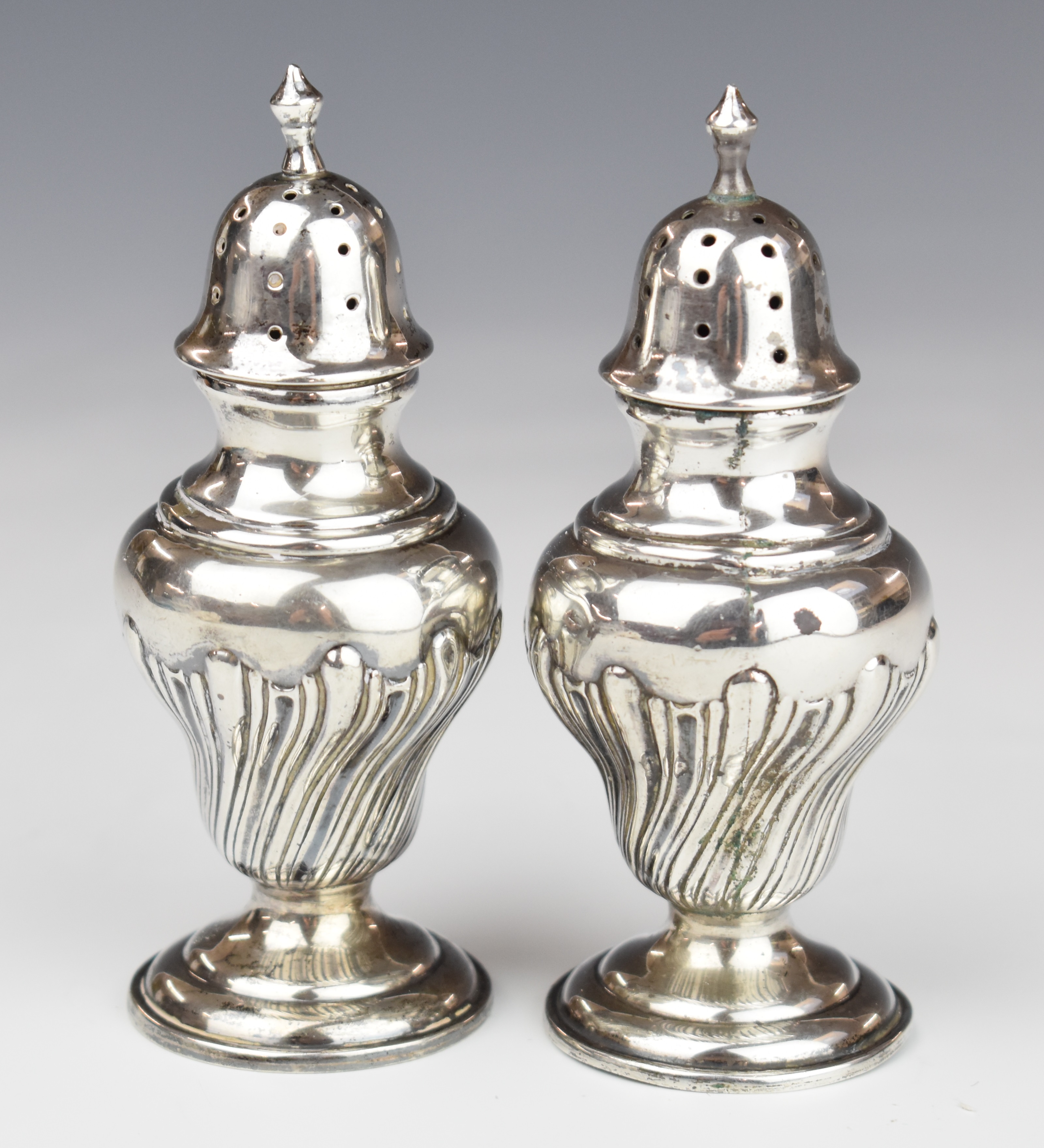 Victorian pair of hallmarked silver peppers, Chester 1900, maker Cohen & Charles, height 10cm,