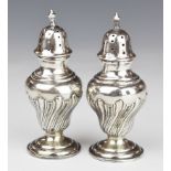 Victorian pair of hallmarked silver peppers, Chester 1900, maker Cohen & Charles, height 10cm,