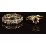 A 9ct gold eternity ring set with spinel and a 9ct gold ring set with an amethyst and cubic