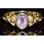 An 18ct gold ring set with an oval cut amethyst and two diamonds, 3.5g, size L - see lot 691 for