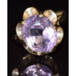 A 9ct gold ring set with an oval cut amethyst, 3.3g, size L