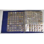 A collection of world coins contained in a Change Checker album