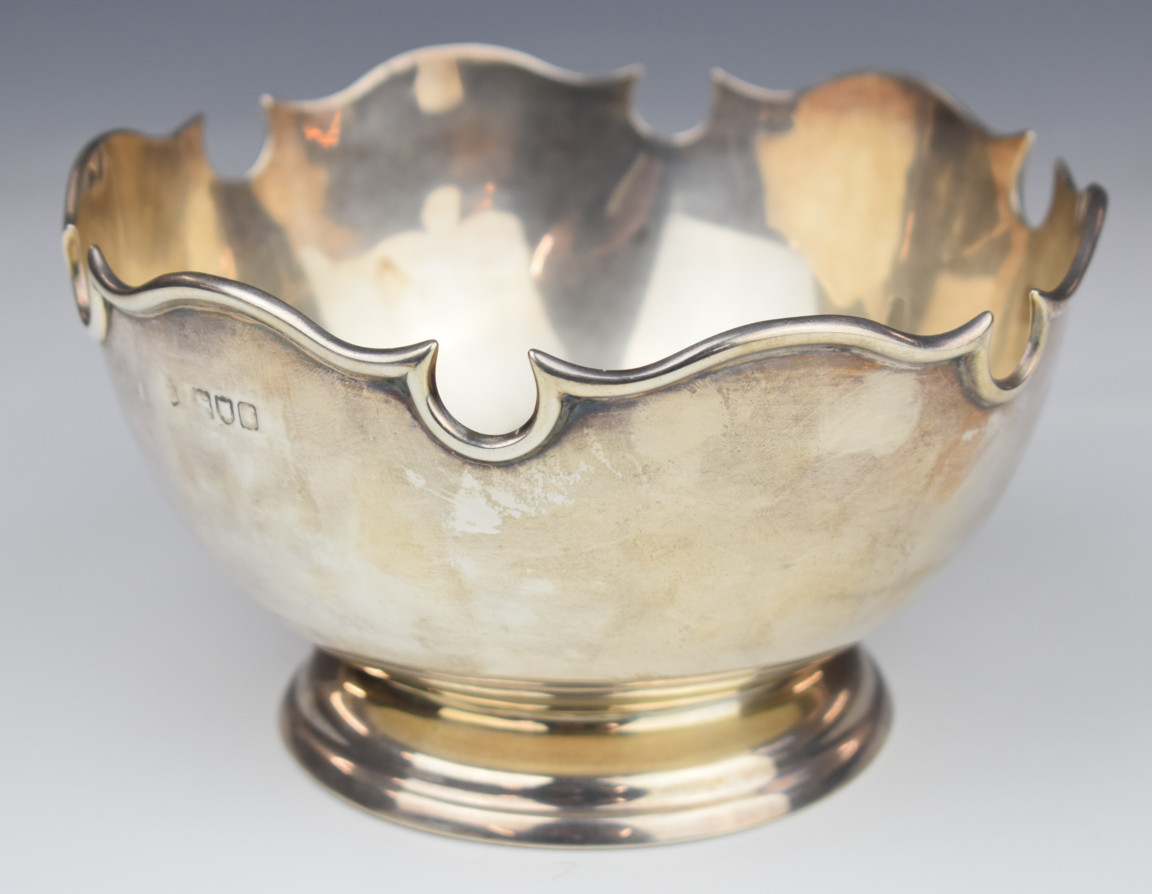 Early 20th century hallmarked silver pedestal rose bowl with shaped edge, marks rubbed but likely