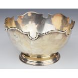 Early 20th century hallmarked silver pedestal rose bowl with shaped edge, marks rubbed but likely