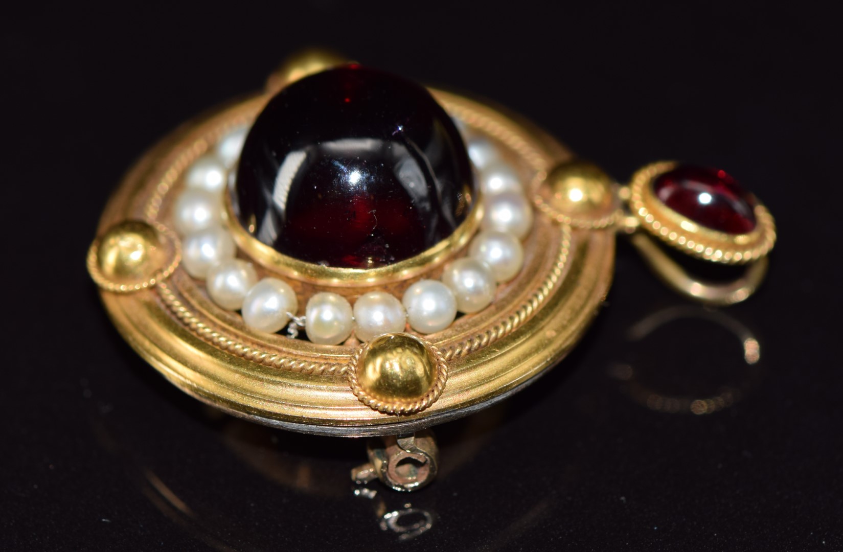 Victorian yellow metal pendant / brooch set with two foiled garnet cabochons surrounded by natural - Image 3 of 4