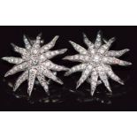 Tiffany & Co pair of platinum earrings set with diamonds in a starburst design, the total diamond