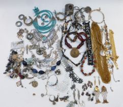 A collection of costume jewellery including necklaces, earrings, bangles, etc