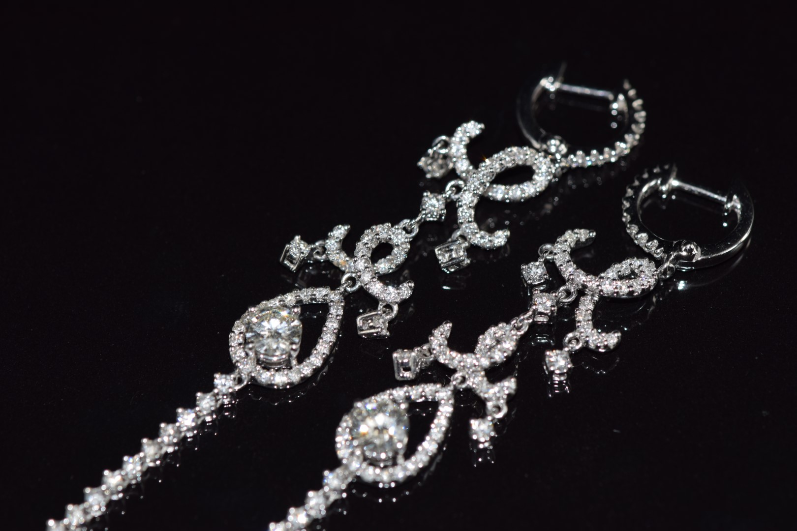 A pair of 18ct white gold earrings set with a diamond of approximately 0.4ct and a quantity of - Image 3 of 3