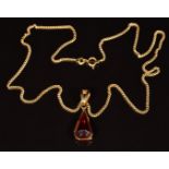 An 18ct gold pendant set with a synthetic ruby, on 18ct gold chain, 9.5g