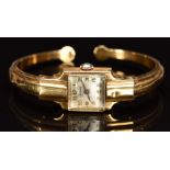 Optima 18ct gold ladies bangle wristwatch with blued hands, gold Arabic numerals, silver dial and 17
