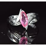 An 18k white gold ring set with a pink Ceylon sapphire and diamonds, 4.7g, size N