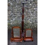 A mahogany torchere plant stand, 150cm high; together with two mahogany dressing mirrors.