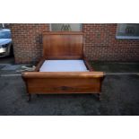 A Continental mahogany sleigh bed, with swan's head decoration, 245cm long x 150cm wide.