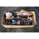 A quantity of Native American figures and a picture.