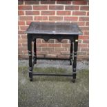 An antique carved occasional table, 66cm wide x 44cm deep x 76cm high.