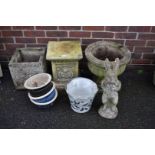 A concrete pedestal urn; together with a square urn and other pots.