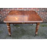 A Victorian mahogany extending dining table, with two leaves, 120cm wide.