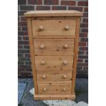 A modern pine five drawer chest, 62cm wide x 42cm deep x 122cm high.
