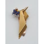 (NB) A stylish brooch set sapphires and diamonds, by Alabaster & Wilson, stamped to front 14ct Pt