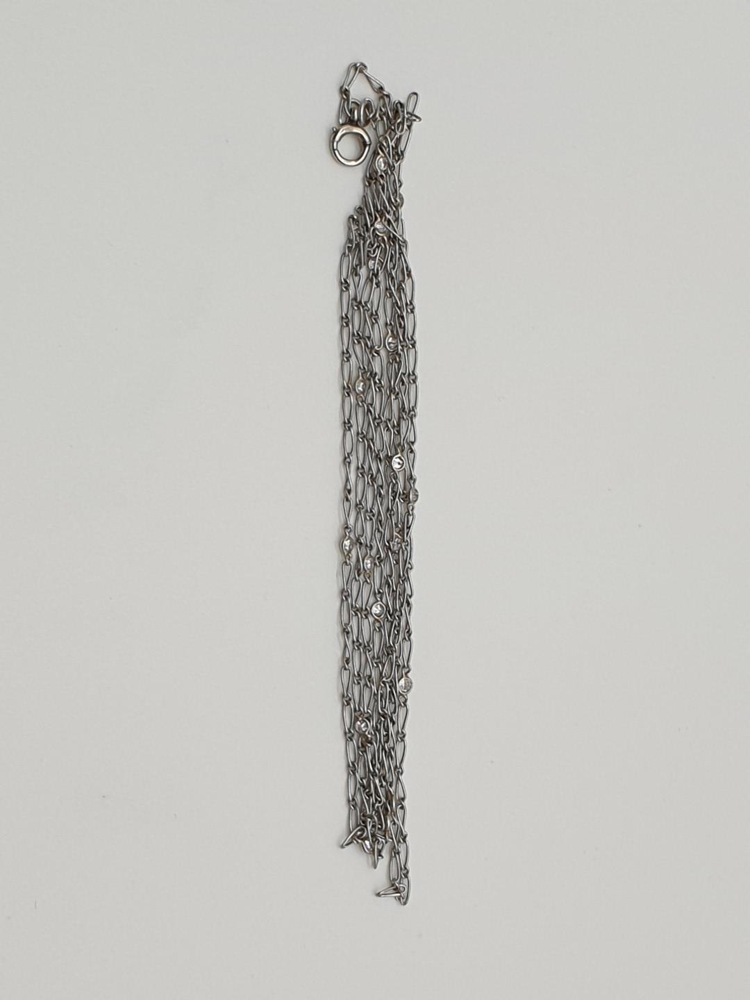 (NB) An unusual pre war chain, interspersed with eighteen collet set diamonds, approx 100cm long,