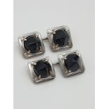 (NB) A pair Art Deco square cufflinks, set onyx with horse bit type links, gross weight 16.7g.