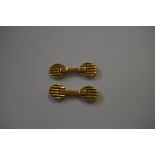 (NB) An unusual pair of Italian yellow metal cufflinks, of ribbed design, maker A G stamped 750